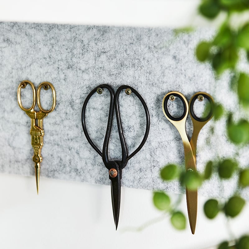 Three alternative scissors used by the design team placed next to each other