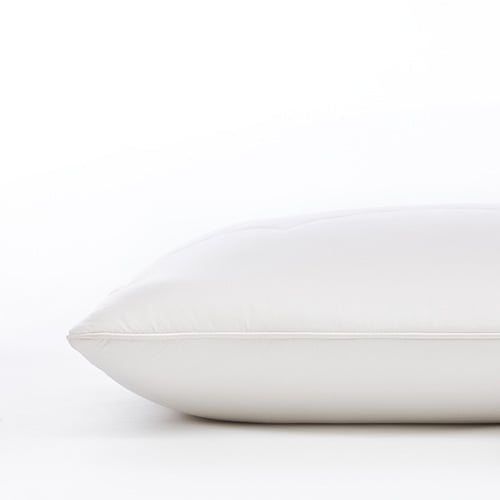 Wool pillow sitting on top of a white table. 