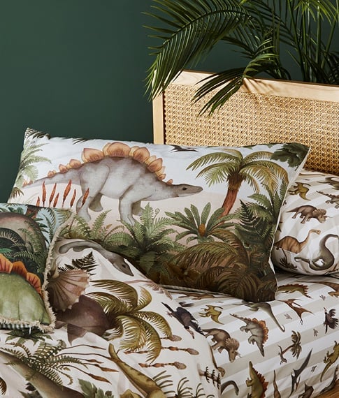 Fleur Harris Prehistorica Pillowcase Separate and matching pillowcase sitting on an Arden Natural Bed.