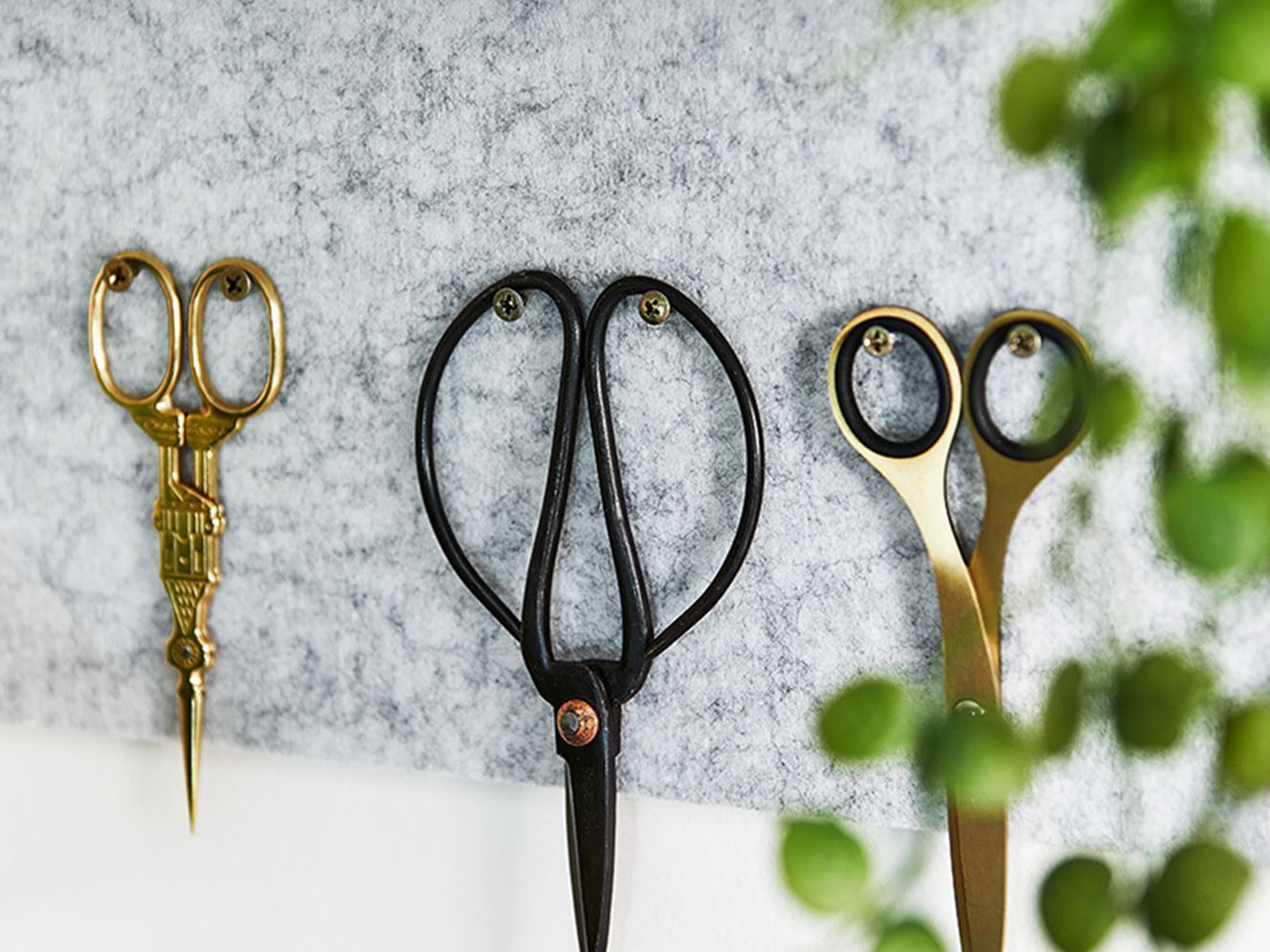 Three alternative scissors used by the design team placed next to each other