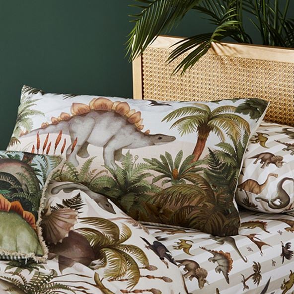 Fleur Harris Prehistorica Pillowcase Separate and matching pillowcase sitting on an Arden Natural Bed.