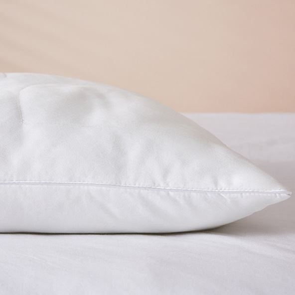 A plump Adairs Kids Bamboo Rich Pillow, perfect for dreamy nights.