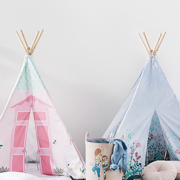 two kids teepees in pink them and light blue floral theme resting behind a toy story storage basket